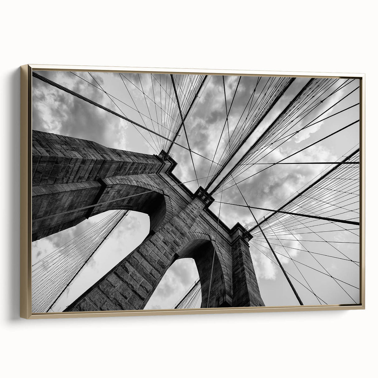Framed canvas of the Brooklyn Bridge in black and gold tones, vintage poster style, ideal for bedroom wall art.