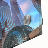 Large abstract depiction of the Manhattan skyline in muted blues and grays on acrylic glass, ideal for dining room art.