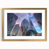 Extra large abstract art print of colorful Manhattan skyline, in gold frame with mat, suited for living room decor.