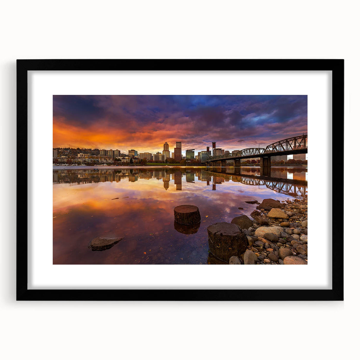 Abstract art print of vibrant, textured colors representing Portland's scenery on a large black-framed canvas.
