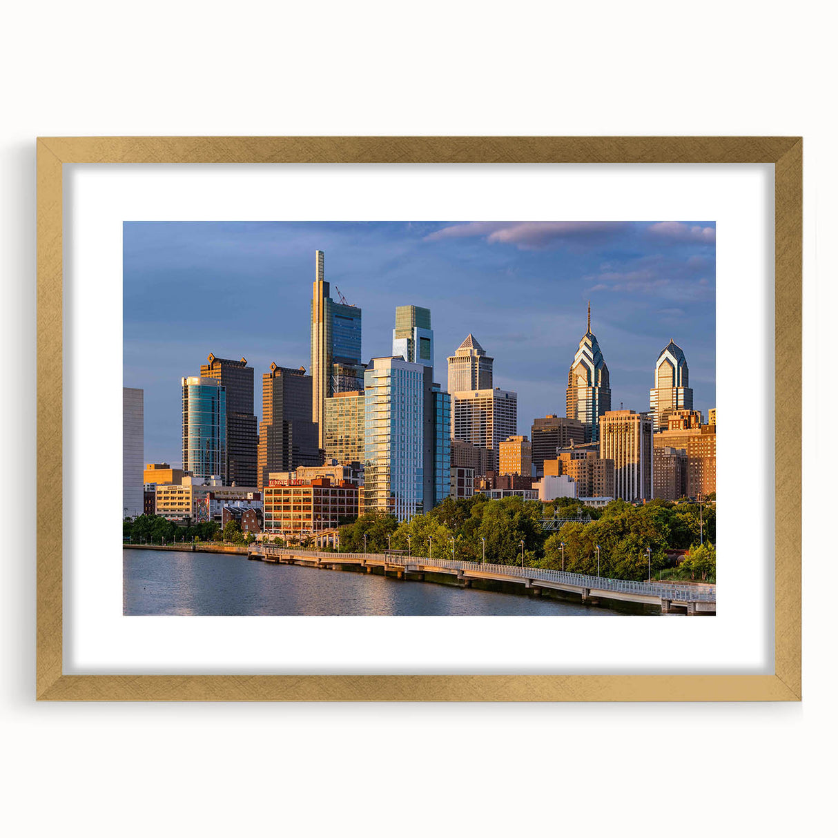 Extra large abstract art print of Philadelphia skyline in textured gold frame, ideal for living room decor.