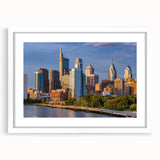 Abstract art print of Philadelphia skyline in muted gray and blue tones, framed with a white mat.