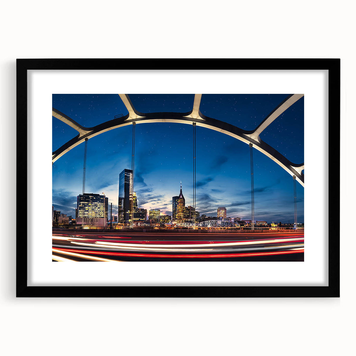 Colorful abstract art print of Nashville skyline, in a black frame with mat, ideal for living room decor.