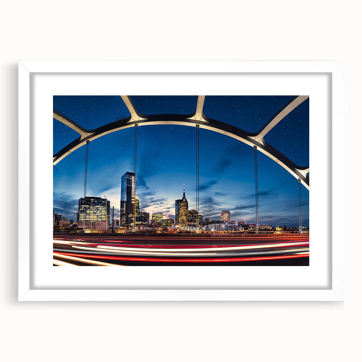 Abstract art print of Nashville skyline in muted gray and blue tones on a framed white mat, ideal for dining room decor.