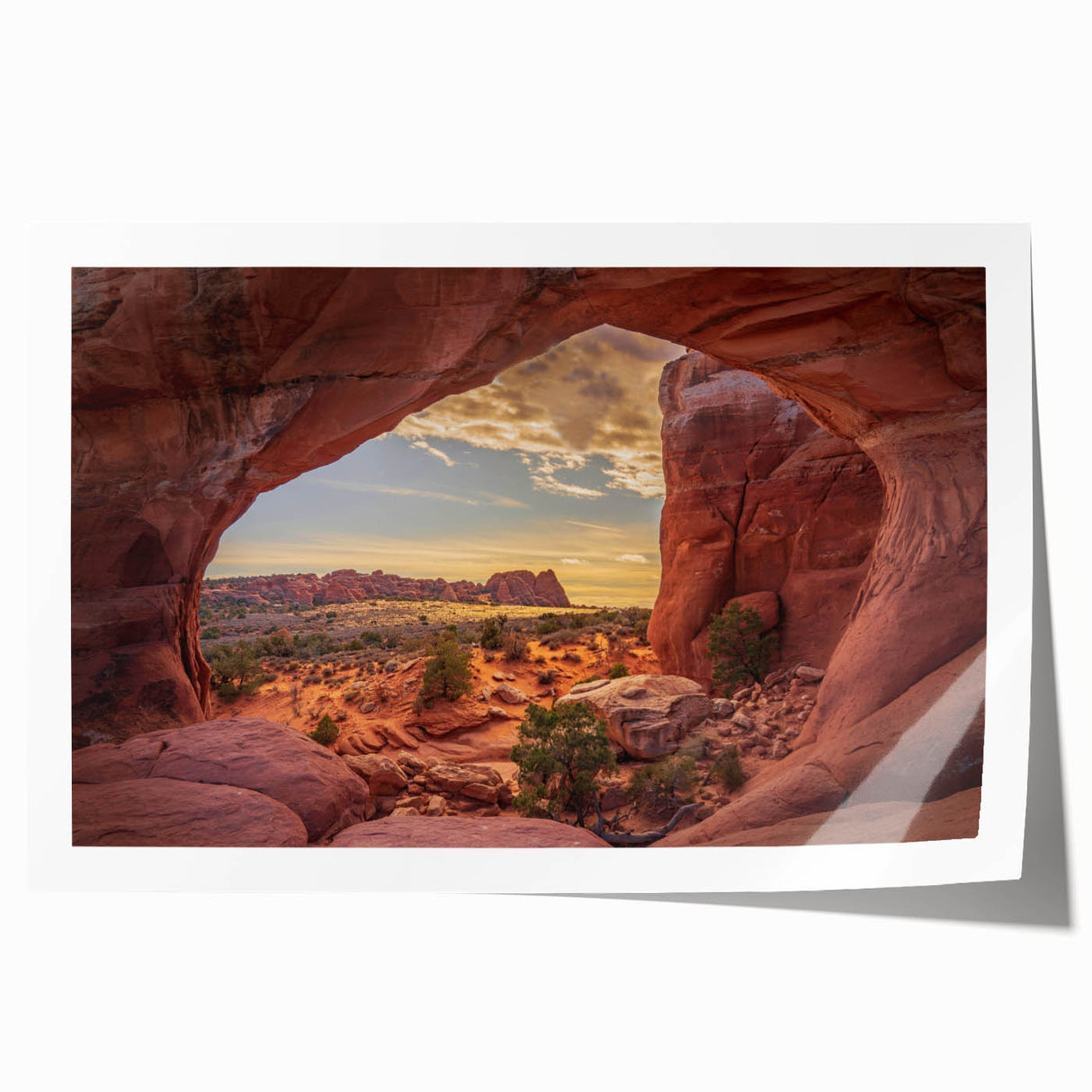 Rolled canvas print of Arches National Park in Utah, featuring red rock formations under a blue sky.