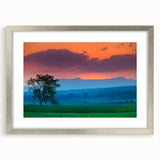 Textured art print depicting an abstract Vermont landscape in subdued green and blue tones, framed with a silver mat.