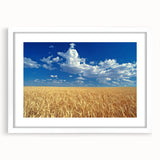 Abstract art print of the Palouse region in muted earth tones on a framed white mat, ideal for dining room decor.