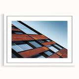 Abstract art print of Seattle skyline in muted gray tones on a framed white mat, suitable for dining room decor.