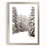 Textured art featuring abstract winter-themed patterns in cool blue and white tones, framed in silver.