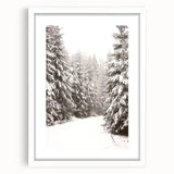 Abstract art print depicting a winter scene in muted blue and white tones, framed with a white mat.