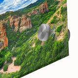 Close-up of a vibrant acrylic landscape painting featuring dramatic cliffs and dynamic colors, perfect for home decor or art enthusiasts seeking inspiration.