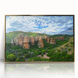 Framed acrylic artwork of dramatic cliffs in a golden frame, showcasing intricate details and vibrant colors, ideal for enhancing modern decor.