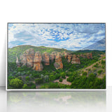 Framed acrylic artwork depicting stunning cliffs and landscapes in vibrant colors, set in a sleek white frame, perfect for enhancing modern home decor.