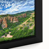 Close-up of a framed canvas artwork depicting a stunning cliff landscape, showcasing vibrant colors and intricate details, perfect for home decor enhancement.