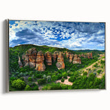 Framed canvas artwork showcasing a serene landscape of cliffs with vibrant colors and intricate details, enhanced with a sleek silver frame, ideal for modern decor.