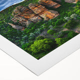 Vibrant rolled canvas print showcasing a breathtaking landscape of cliffs and ocean waves, perfect for home decor. The artwork features rich colors and intricate details, ideal for nature lovers and art enthusiasts.