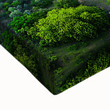 Close-up of a vibrant stretched canvas artwork depicting a dramatic landscape of cliffs under a bright blue sky, showcasing rich colors and textures ideal for home decor.