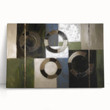 Abstract geometric stretched canvas artwork showcasing vibrant blue, gold, and white patterns, leaning against a neutral-toned wall, perfect for modern decor.