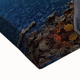 Close-up of a vibrant stretched canvas artwork depicting a serene landscape bridge with lush greenery and a blue sky, perfect for modern home decor.