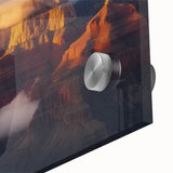 Close-up of a vibrant acrylic landscape artwork depicting canyons, showcasing rich colors and intricate details on a glass surface, ideal for modern home decor.