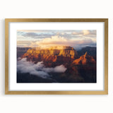 Elegant gold-framed landscape artwork showcasing stunning canyons, accented with a white mat, perfect for home decor and enhancing interior aesthetics.