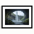Framed landscape artwork showcasing a serene cave scene with a black mat and sleek frame, ideal for modern home decor and art enthusiasts.