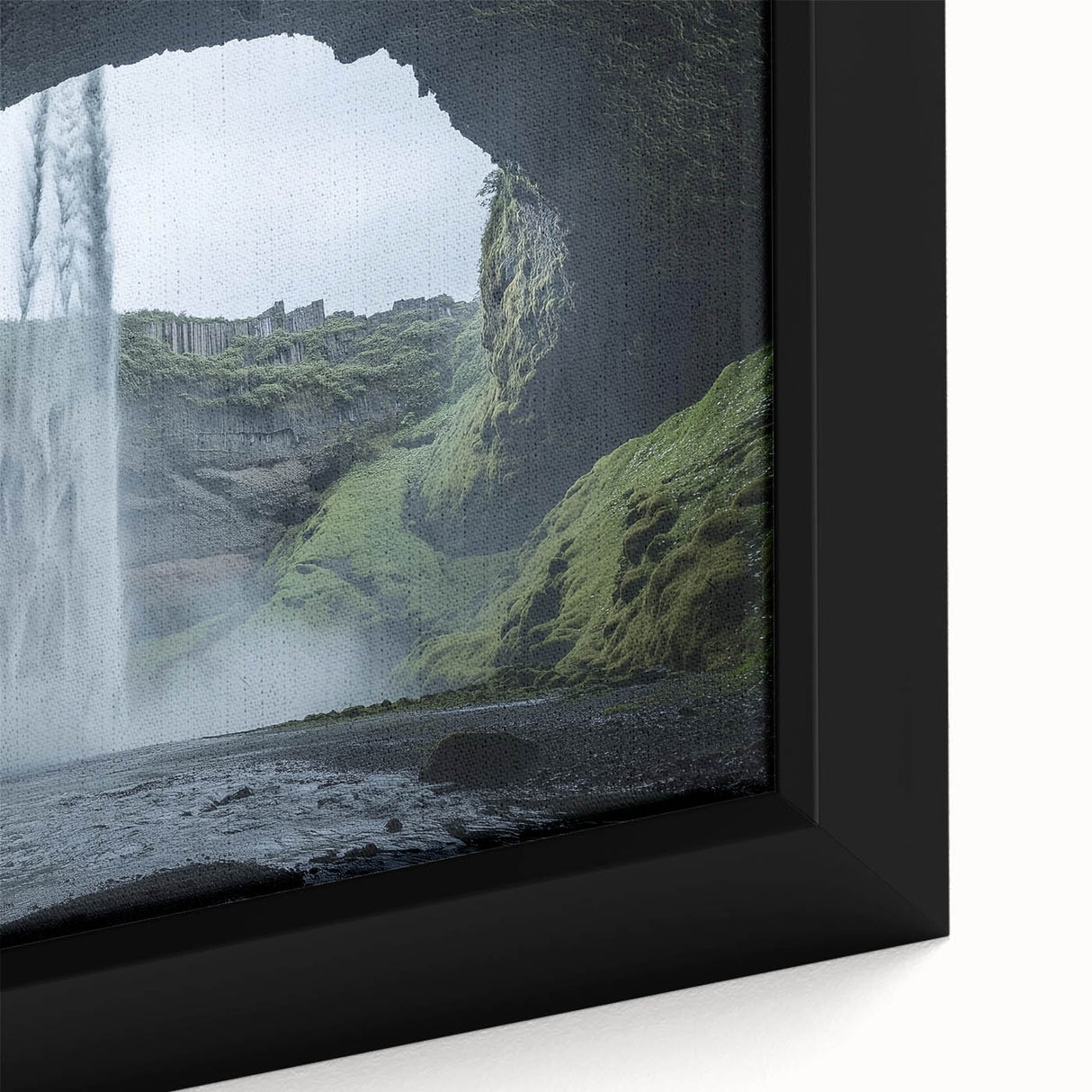 Close-up of a framed canvas artwork depicting a serene landscape with intricate cave formations, showcasing vivid colors and detailed textures, ideal for home decor.
