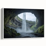 Framed canvas art depicting a serene landscape with caves, featuring earthy tones and intricate details, elegantly showcased against a white background.