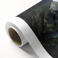 Rolled canvas showcasing a vibrant landscape scene with caves and natural formations, featuring rich colors and intricate details, perfect for home decor.