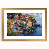 Elegant gold-framed landscape artwork showcasing dramatic cliffs and serene skies, perfect for home decor or office settings, enhancing any interior aesthetic.