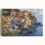 Stretched canvas artwork showcasing a stunning landscape of towering cliffs under a vibrant sunset sky, perfect for home decor or office enhancement.