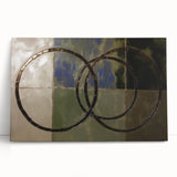 Abstract geometric stretched canvas artwork showcasing vibrant colors and dynamic shapes, perfect for modern home decor, leaning against a wall in a stylish setting.