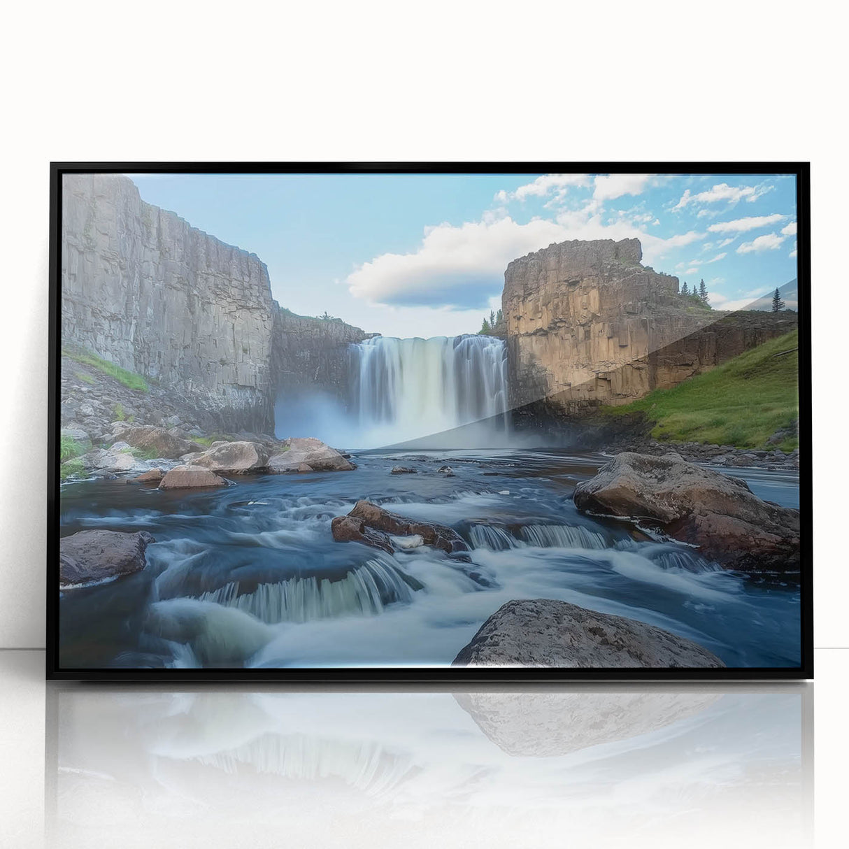 Framed acrylic landscape artwork depicting vibrant canyons in rich earth tones, set in a sleek black frame, ideal for enhancing modern home decor.