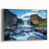 Framed canvas artwork showcasing a dramatic landscape of canyons, featuring rich earthy tones and silver frame accents, perfect for enhancing modern home decor.