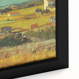 Close-up of a textured, extra large framed canvas depicting a black abstract design with colorful accents.