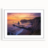 Framed landscape artwork depicting majestic cliffs with a white mat, showcasing natural beauty and vibrant colors, perfect for home decor or office spaces.