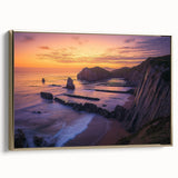 Framed canvas artwork depicting a dramatic cliff landscape with vibrant colors and intricate details, featuring a gold side frame for an elegant finish.