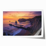 Stunning landscape print showcasing dramatic cliffs against a vibrant sunset, rolled for easy transport and framed display, ideal for home decor enthusiasts.
