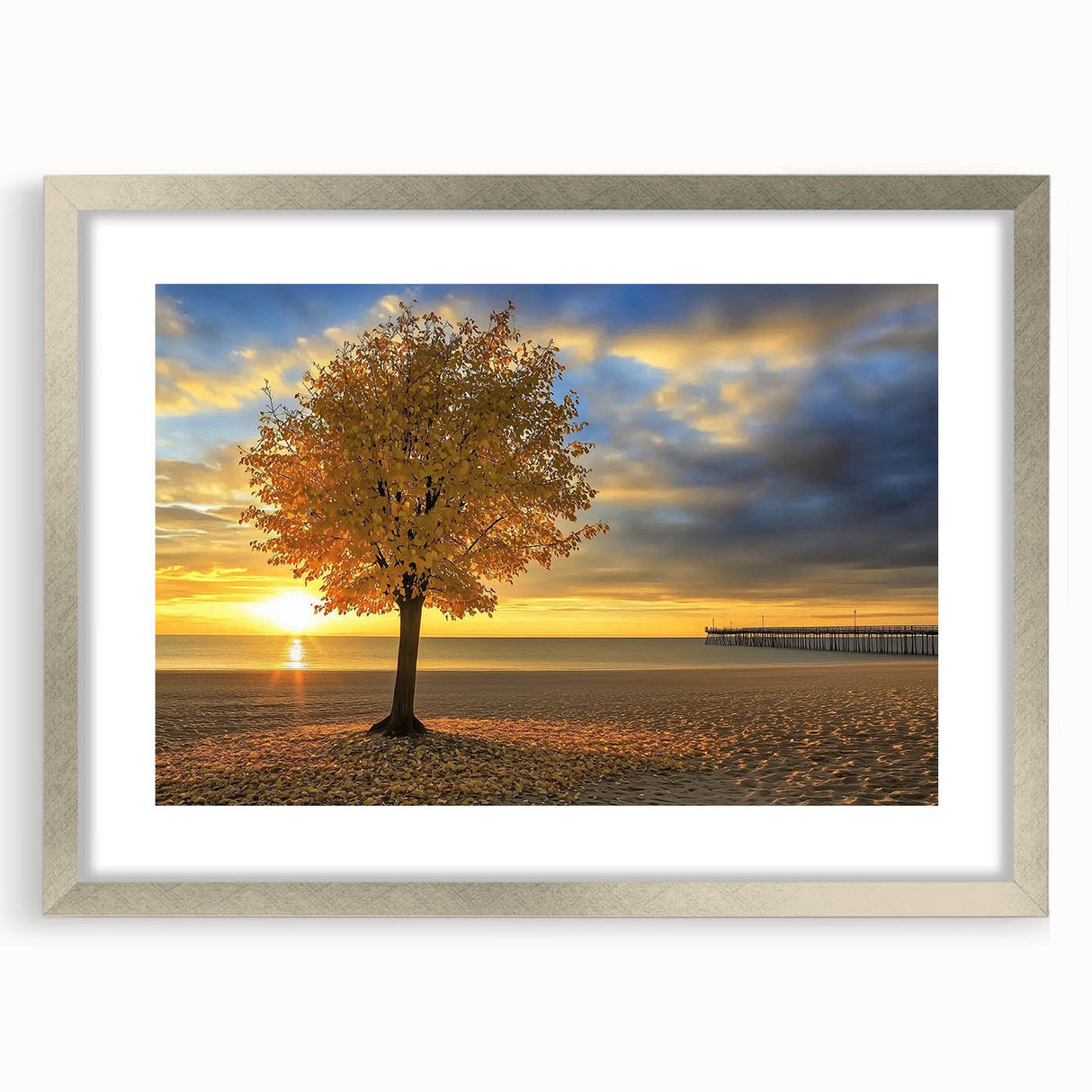 Silver-framed landscape artwork featuring a serene beach scene with gentle waves and soft sand, elegantly matted for a polished presentation, ideal for coastal decor.