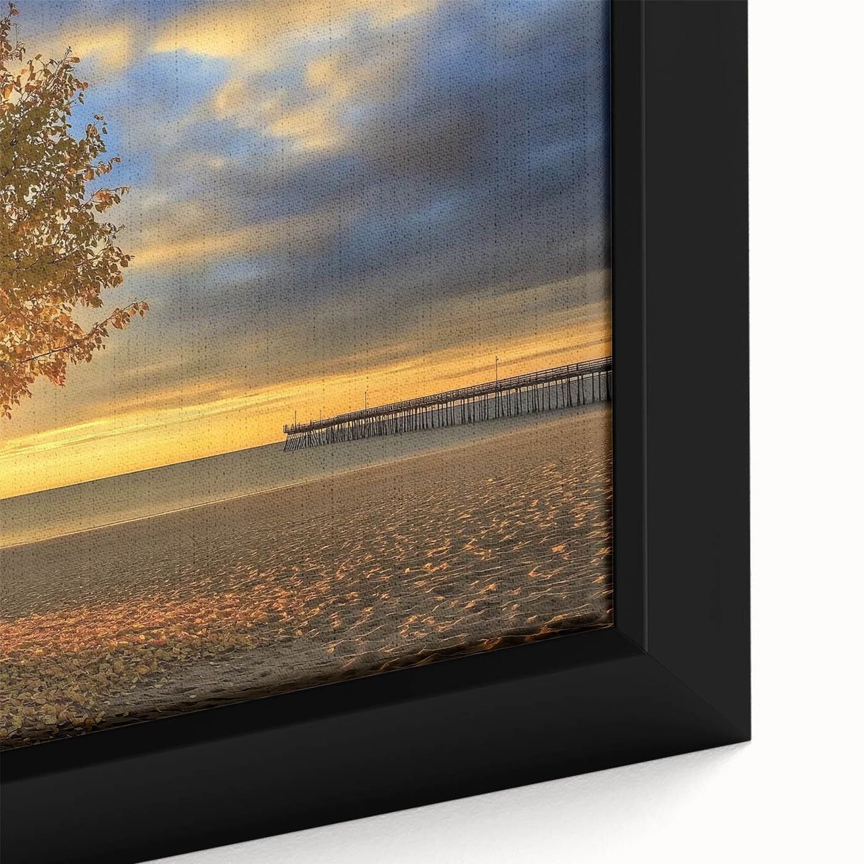 Close-up of a framed canvas depicting a serene beach landscape, showcasing vibrant blues and sandy tones, perfect for coastal home decor. Ideal for beach enthusiasts.