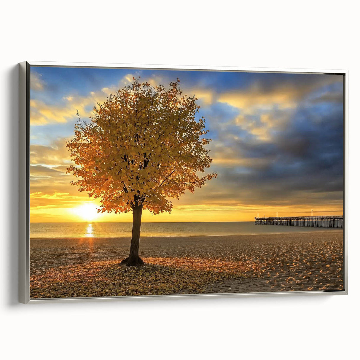 Framed canvas artwork depicting a serene beach landscape, showcasing soft waves and a vibrant sunset, enhanced with a silver frame for an elegant presentation.
