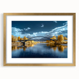Elegant gold landscape bridge frame with a white mat, showcasing a scenic view, ideal for enhancing home decor and adding a touch of sophistication.