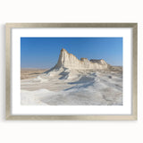 Framed landscape art print showcasing vibrant canyons in warm earth tones, complemented by a sleek silver mat, perfect for home decor or office aesthetics.