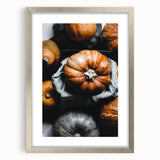 Textured art depicting abstract fall trees in orange and gold tones on a framed silver mat, ideal for bedroom wall decor.