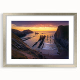 Framed landscape artwork depicting majestic cliffs with a silver mat, showcasing intricate details and vibrant colors, perfect for home decor enhancement.