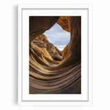 Landscape canyon artwork framed in a sleek white mat, showcasing vibrant colors and intricate details, perfect for home decor or office styling.