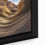 Close-up view of a framed landscape canvas depicting vibrant canyons in rich earthy tones, showcasing intricate details and textures, enhancing home decor aesthetics.