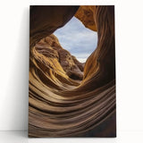 Stretched canvas artwork depicting vibrant canyons in a dramatic landscape, showcasing rich colors and textures, perfect for enhancing home decor with a nature-inspired theme.