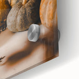 Large abstract wall art depicting fall foliage in warm orange and yellow tones on acrylic glass.