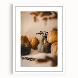 Abstract art print depicting autumnal hues in a minimalist style, framed in white, ideal for bedroom or dining room decor.